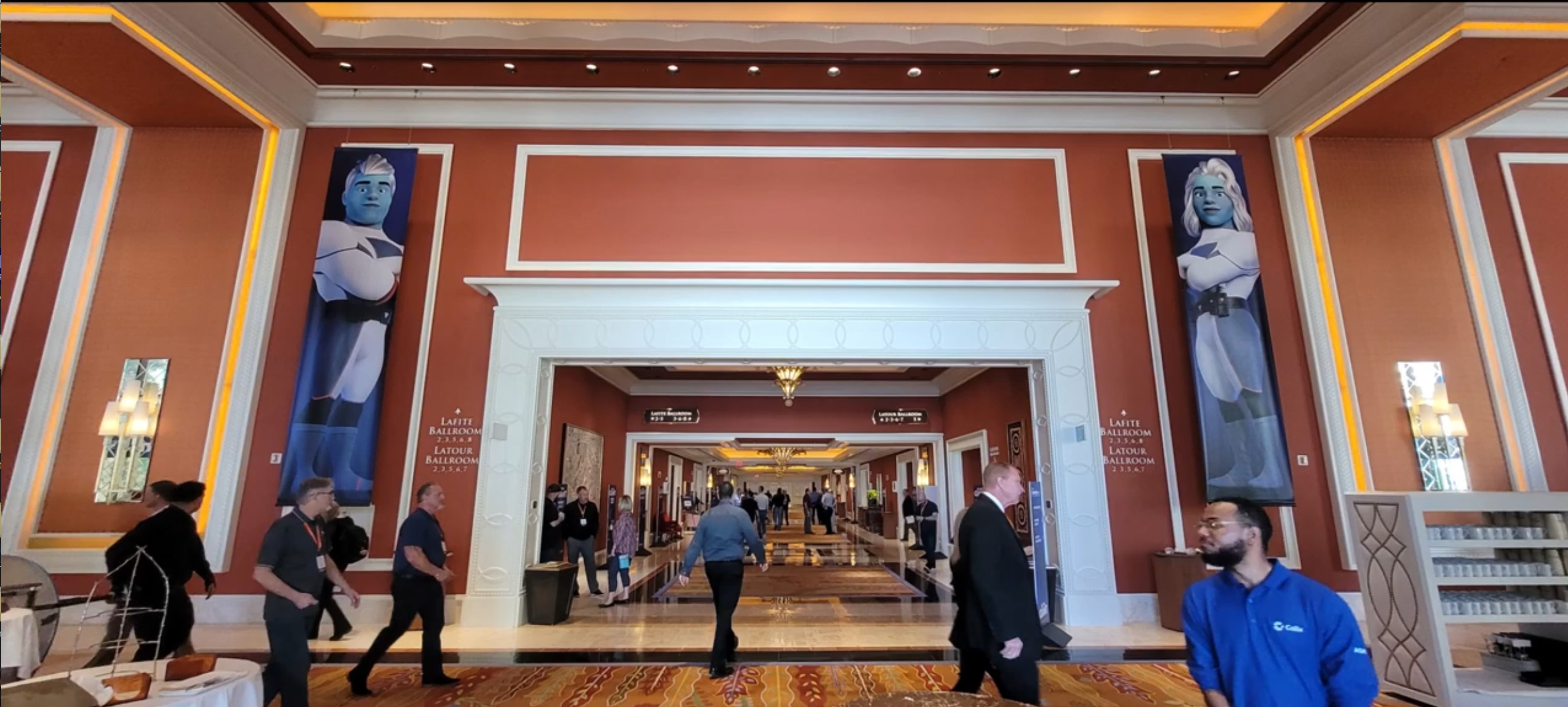 Multiple character prints displayed on glass surfaces throughout venue showing complete installation